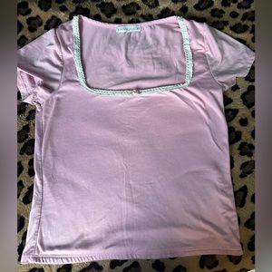 Simple coquette pink croptop with lace and a rose in the front, plain back